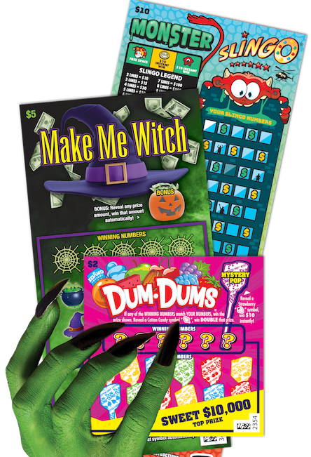 Green witch hand holding three Idaho Lottery Scratch Games