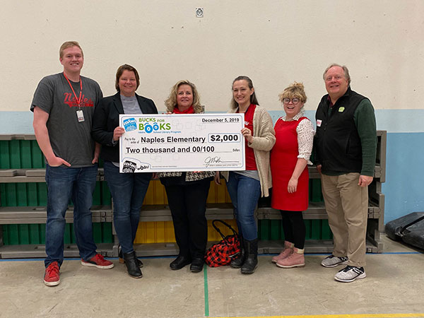 Amber Balk (center, right) with Lottery, School, and District Staff